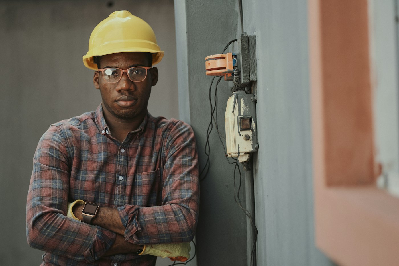 Illustrative photo of an electrician at a panel